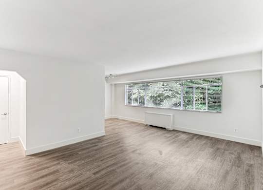A room with a window and a door.
