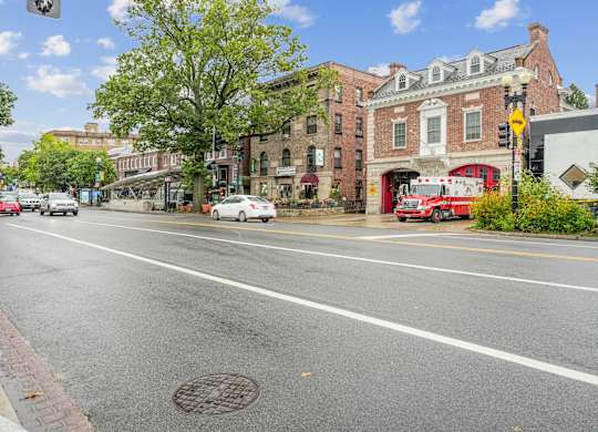 A street view with cars, buildings, and a fire truck.