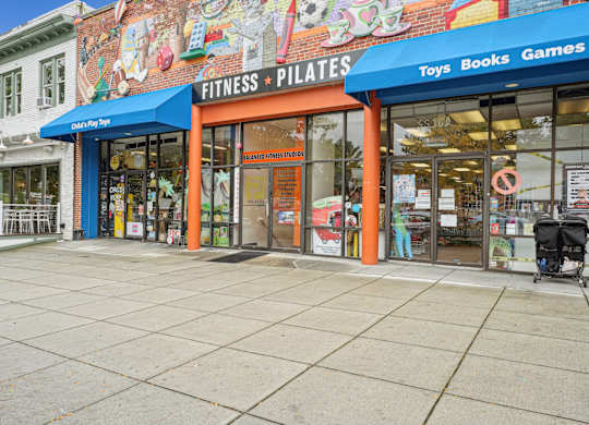 A storefront with a sign that reads The Kenmore, Washington, 20015