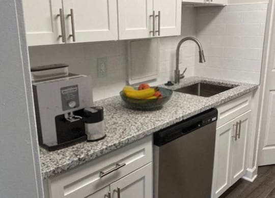 White kitchen cabinets at Wellington Apartments, Arlington, VA, 22204