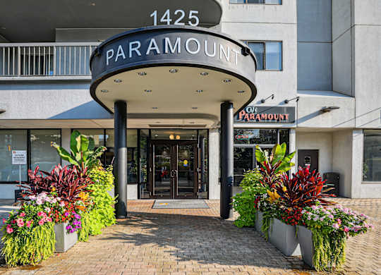 The entrance to a building with a sign that reads