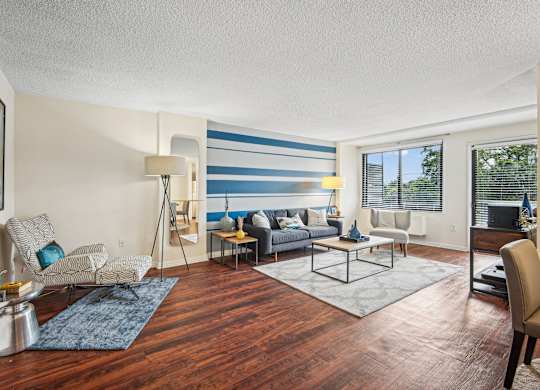 A living room with a wooden floor and furniture at Riverside Apartments, Alexandria, Virginia