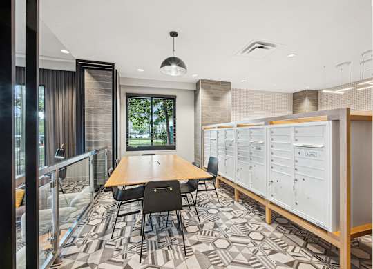 A conference room with a long table and chairs, a whiteboard, and a window with curtains.