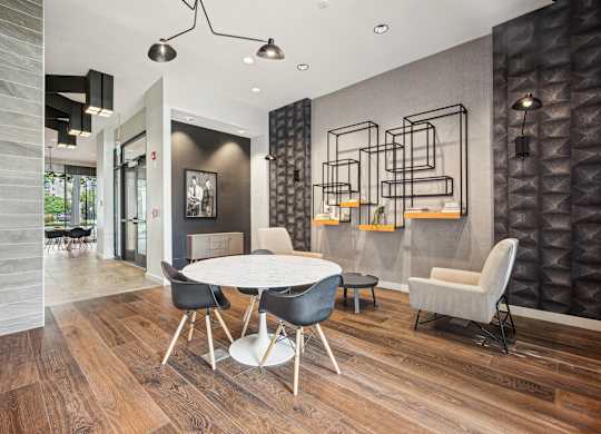 A modern dining room with a white table and chairs at Riverside Apartments, Alexandria, Virginia