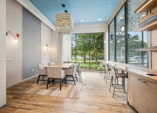 A modern dining room with a long table and chairs at Riverside Apartments, Alexandria, Virginia