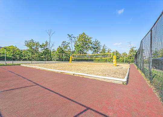A tennis court with a net at Riverside Apartments, Alexandria, Virginia