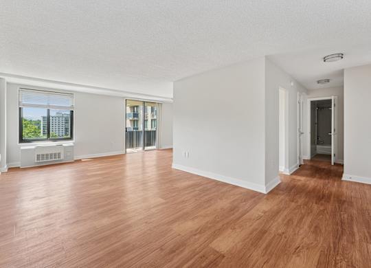 A room with wooden floors and white walls.