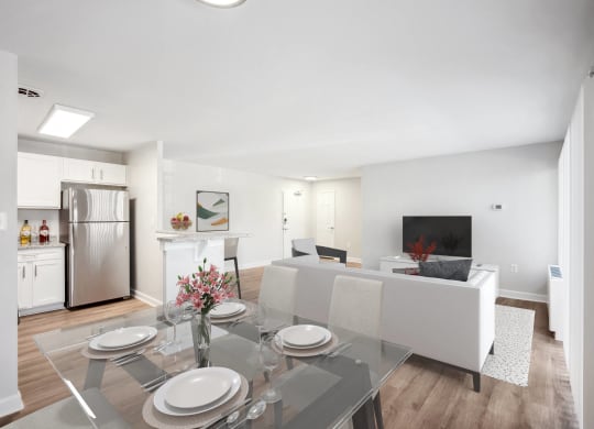 a living room and dining room with a glass table and chairs at Roosevelt Towers, Falls Church, VA