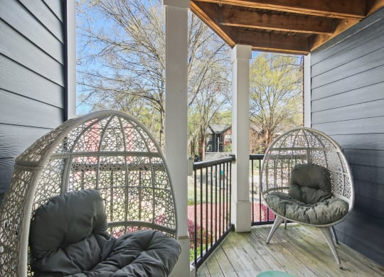 two chairs on a balcony at Elme Druid Hills, Atlanta, Georgia