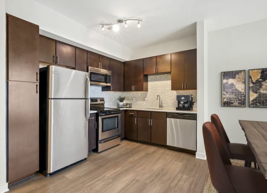 Kitchen with stainless steel appliances at The Maxwell Apartments, Virginia, 22203