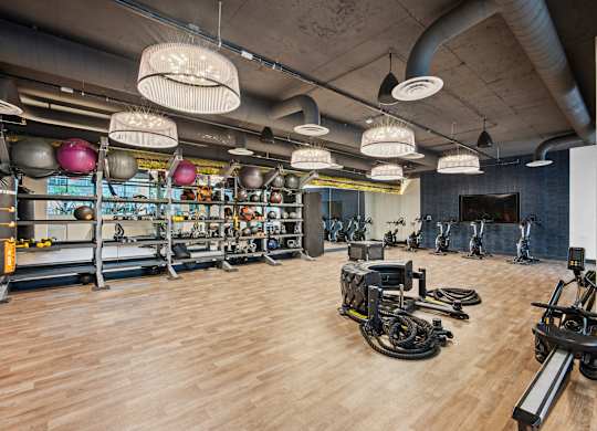 A gym with a variety of exercise equipment.