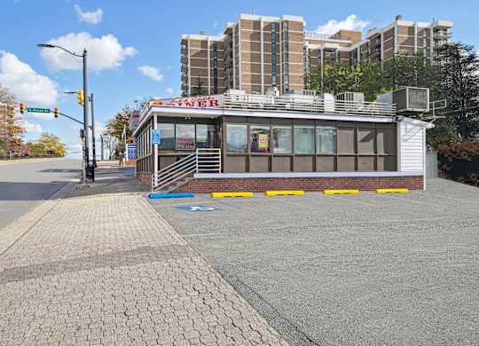 A small building with a red sign that says