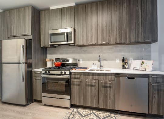 Kitchen cabinets and appliances at Trove Apartments, Virginia, 22204