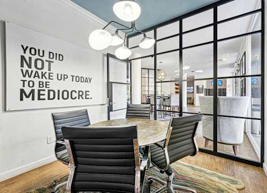 A conference room with a sign on the wall that says