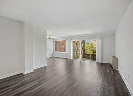 A room with wooden floors and white walls at Wellington Apartments, Arlington, Virginia