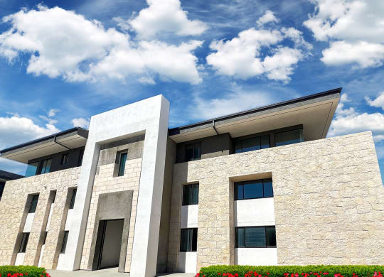 a picture of a building with a blue sky and clouds at The Max on Jefferson Apartments, Murrieta, 92562
