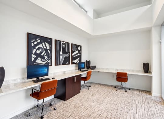 a large office with desks and chairs and a window at The Max on Jefferson Apartments, Murrieta, 92562