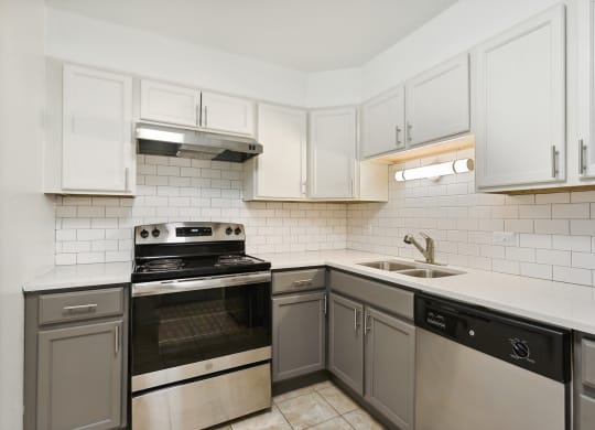 a kitchen with white cabinets at The Hinsdale, Hinsdale, IL, 60521