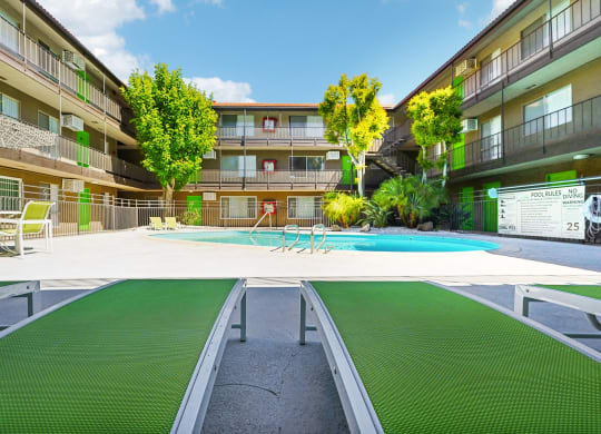 a swimming pool in the middle of an apartment building