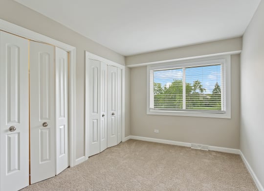 a bedroom with a window at The Hinsdale, Hinsdale, IL, 60521