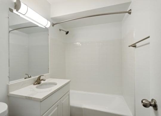 a bathroom with a sink and a bathtub at The Hinsdale, Illinois, 60521
