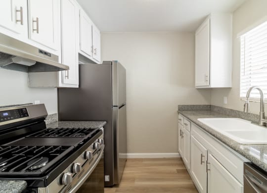 Fully equipped kitchen with stainless steel appliances at Alturas Paso Robles Apartment Homes, Paso Robles
