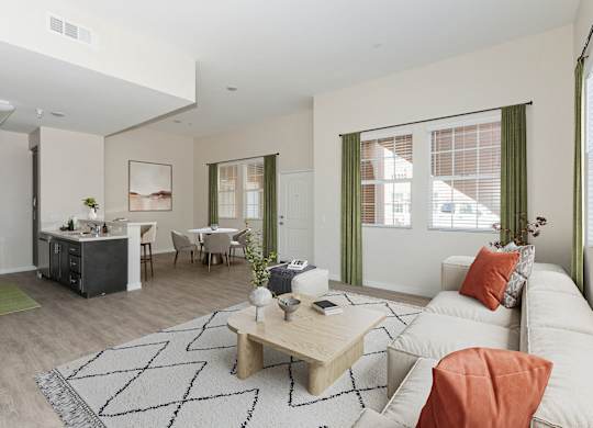 A living room with a white couch and a coffee table.