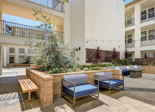 courtyard with tables and chairs at the preserve at great pond apartments in windsor at Arrive Los Carneros II, Goleta