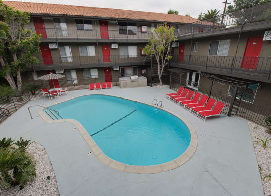 our apartments showcase an unique swimming pool at Dwell Apartment Homes, Riverside, CA
