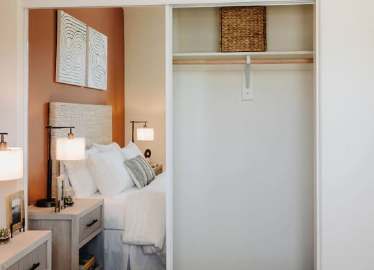 a bedroom with a bed and a closet with a sliding door at Arrive Paso Robles, Paso Robles