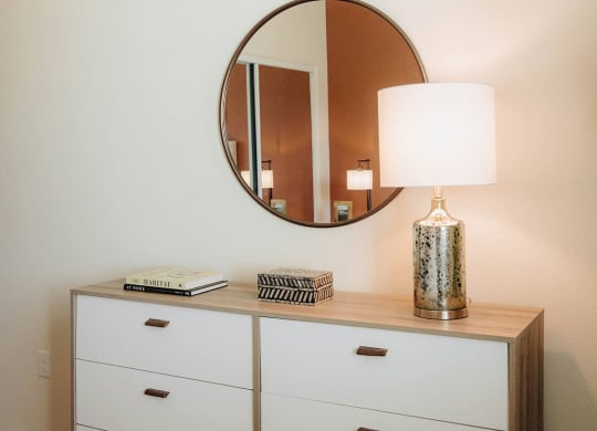 a dresser with a lamp and a mirror at Arrive Paso Robles, California