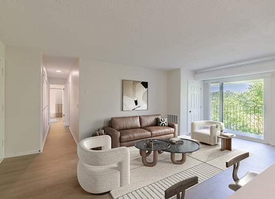 A modern living room with a brown leather couch and a white chair.