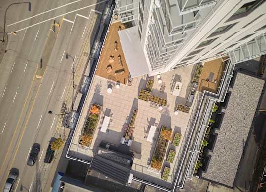A view of a city street from above with cars and buildings.