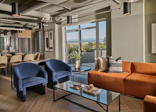 A modern living room with a view of the ocean.