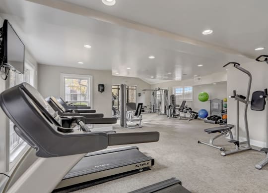 a gym with treadmills and other exercise equipment at Veridian Sandy Springs