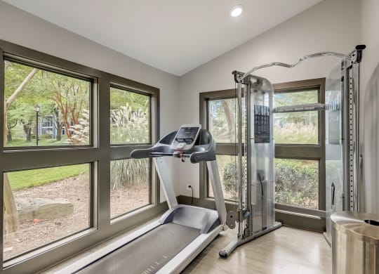 Wynnwood Vinings Atlanta fitness center room with windows and a treadmill