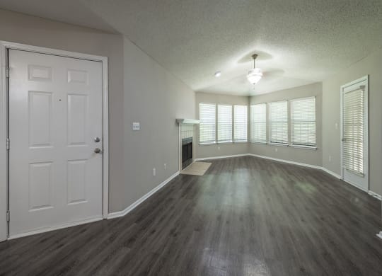 an empty living room with a fireplace at eclipse apartments duluth ga