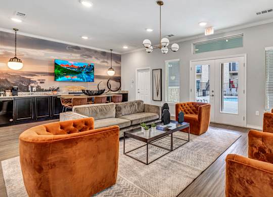 Leasing office room with couches and chairs and a table
