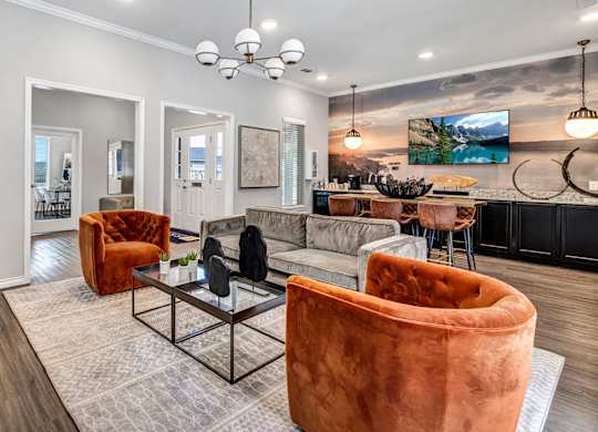 a living room with couches and chairs