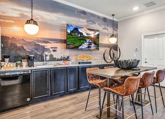 a clubhouse kitchen and dining table and chairs