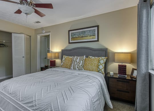 a bedroom with a large bed and a ceiling fan at Wynnwood Vinings Atlanta