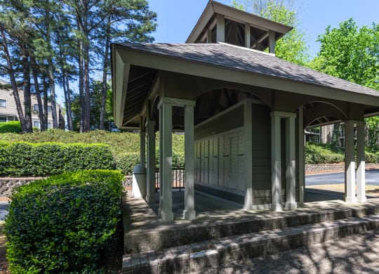 Mail station at Wynnwood Vinings Atlanta with trees and bushes in the background