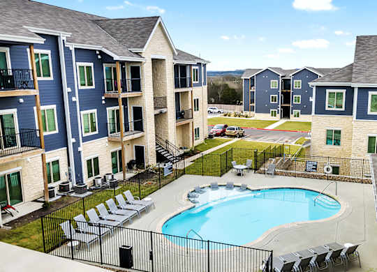 an aerial view of Sendero Ridge Apartments Kerrville with a swimming pool