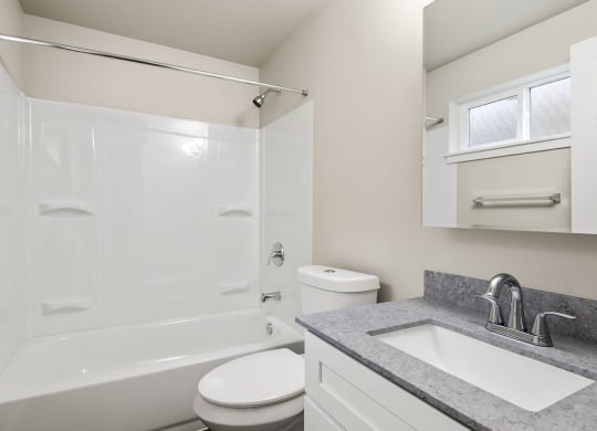 a bathroom with a sink toilet and a shower