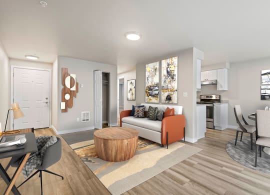 a living room with hardwood floors and view into dining room and kitchen at Foster Creek apartments in Tukwila