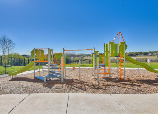 a newly renovated childrens playground at the heights at converse apartments in texas