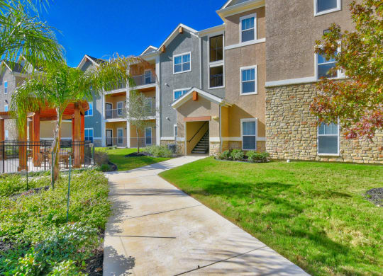 heights at converse apartments sidewalk into apartment building