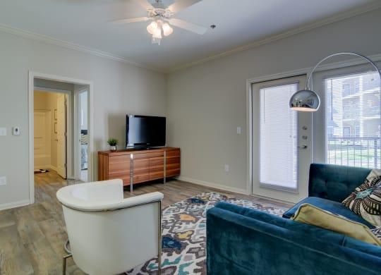 heights at converse apartments living room with rug chairs and TV