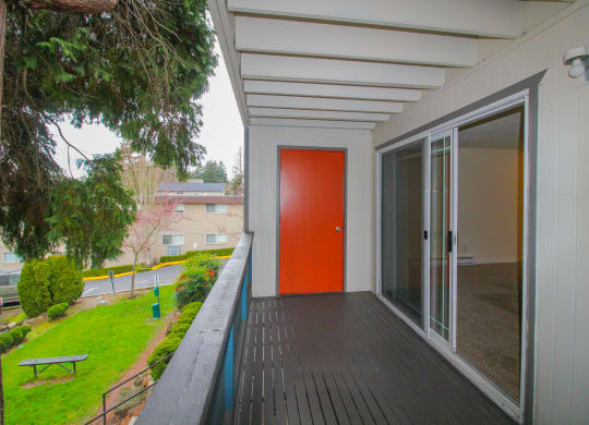 Tukwila, WA Apartments for Rent - Foster Creek - Private Balcony with Storage Closet Overlooking the Community with Lush Grass and Trees