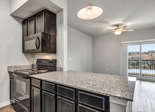 the kitchen of a home with a granite counter top